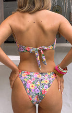 Back view of the white zebra floral bikini top with a bow tie closure