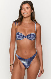Front view of a navy gingham bikini top featuring a sweetheart neckline and tie-shoulder straps