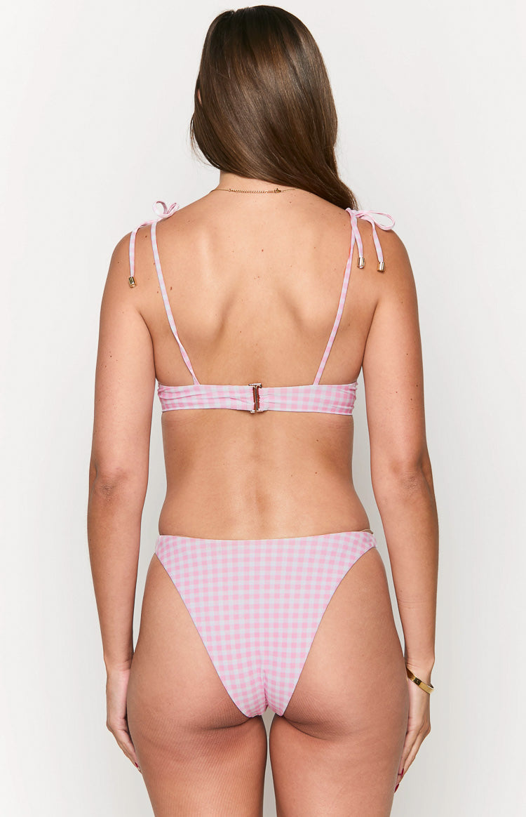 Rear view of a pink gingham bikini top with tie-shoulder straps and a metal back clasp