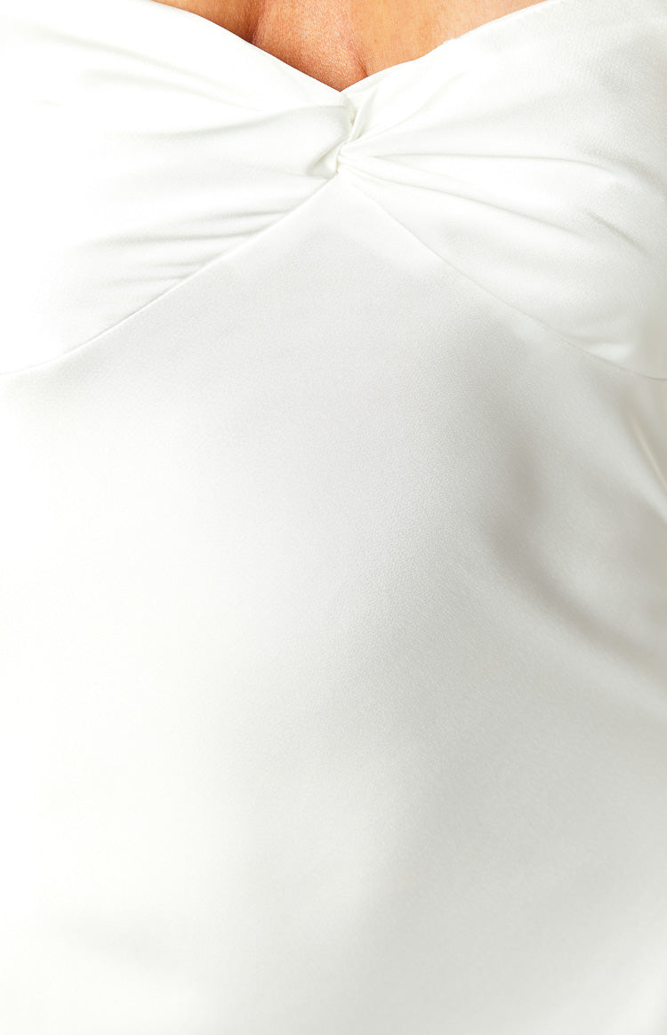 Close-up of the white dress showing the twisted knot detail on the smooth sweetheart neckline
