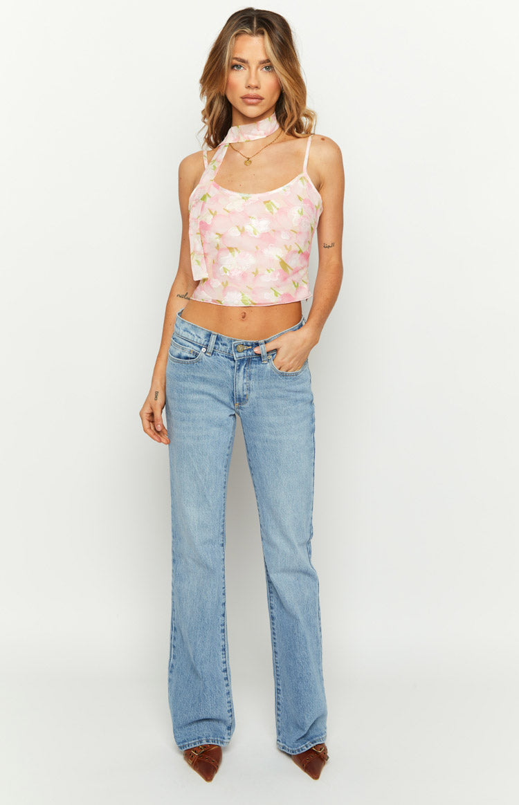 Close-up of the pink floral print cami top showing the textured fabric and shoulder strap