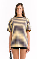 Model wears an oversized yellow and white stripe tee perfect for casual weekend outfits.
