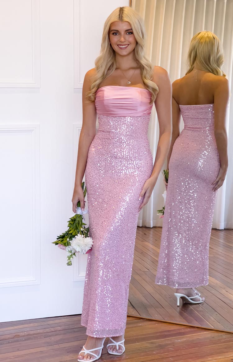 Full length pink sequin strapless maxi dress with a ruched satin bust, reflected in a mirror to show the back