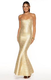 Full length view of a gold strapless bandage maxi dress with a crossover bust and flared mermaid hem