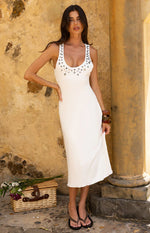 White ribbed knit midi dress with scoop neckline and scattered grey and iridescent buttons