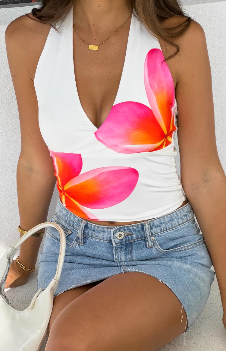 Beginning Boutique Amora White Frangipani Print Halter Top white v-neck halter top with pink and orange frangipani print
