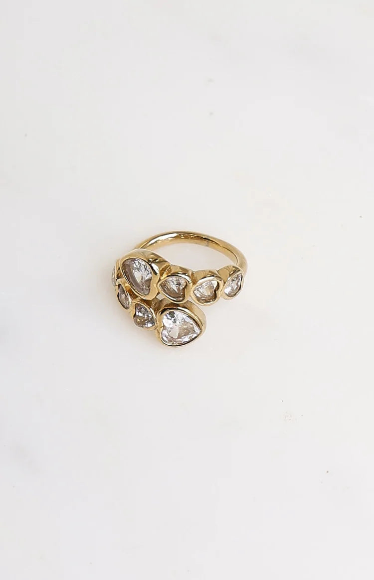 Beginning Boutique Amore Gold Heart Diamante Wrap Ring gold-toned ring with multiple clear heart-shaped diamantes in a wrap d