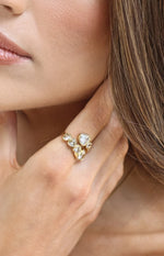 Close-up of the gold wrap ring with multiple heart-shaped diamantes