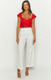 Red crop top with a sweetheart neckline, fitted bodice, and short ruffled cap sleeves