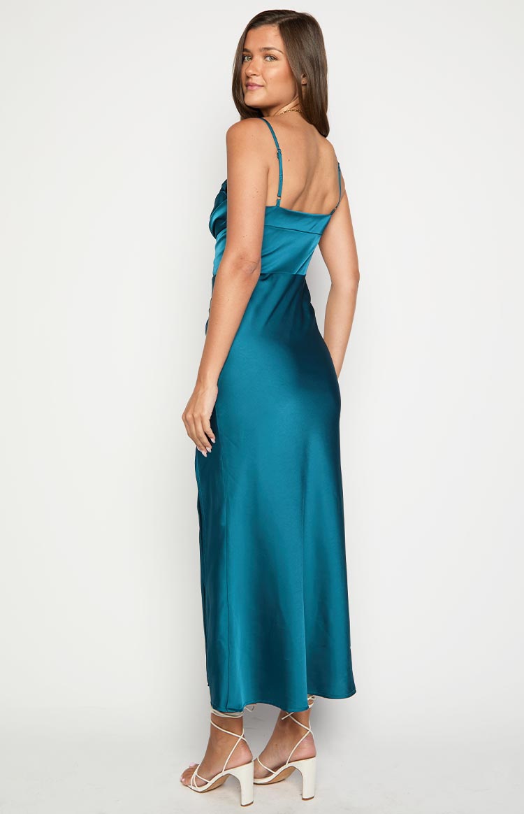 Side view of a green satin maxi dress showing the draped cowl neck, thin straps, and a high side slit