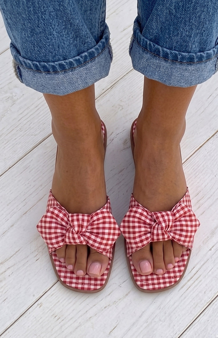 Beginning Boutique Ariel Red Check Bow Sandals red and white gingham check slide sandals with a large bow detail on the strap
