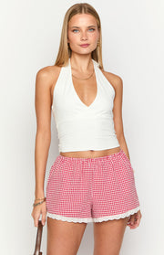 Red gingham shorts featuring an elasticated waist and white broderie lace scalloped hem