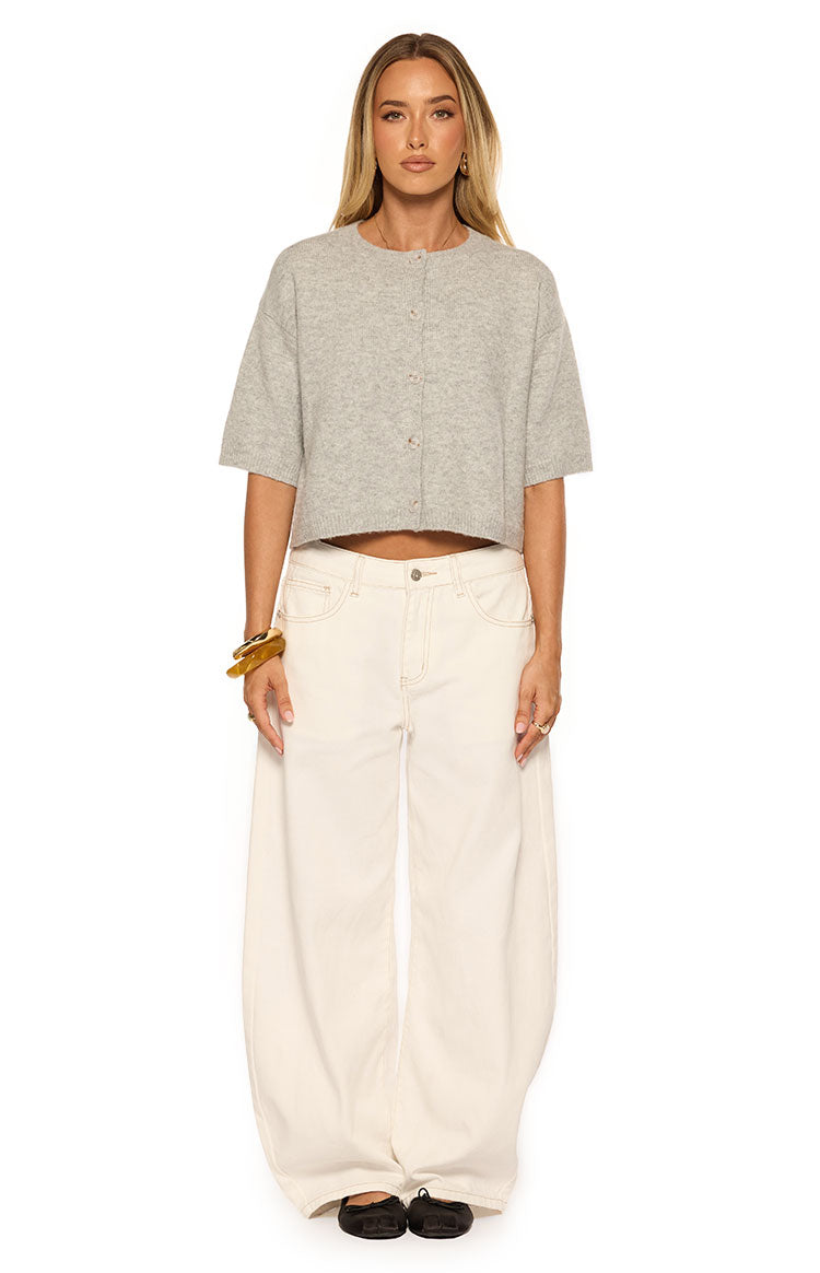 Front view of a light grey knit cropped cardigan with short sleeves and a crew neck button-front