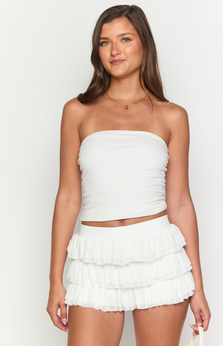 White tiered ruffle shorts with a flat waistband and flowy fabric