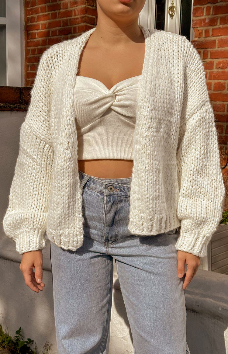 Cream chunky knit cardigan with an open front, dropped shoulders, and ribbed cuffs