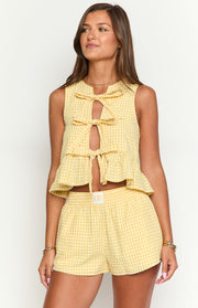 Relaxed fit yellow gingham shorts with a shirred elastic waistband and a small white logo label