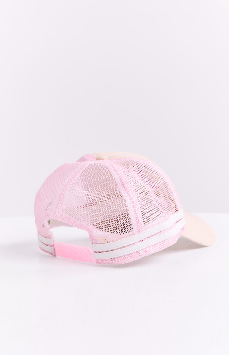 Rear view of a cream trucker cap with pink mesh panels, white stripes, and a pink adjustable snapback closure