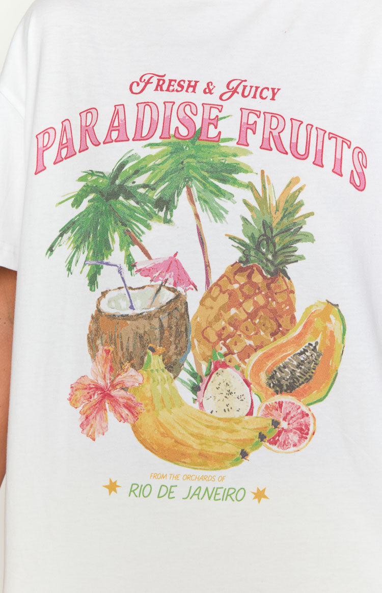 Close-up of the white tee's tropical graphic print with Paradise Fruits text, palm trees, coconut, pineapple, papaya, and bananas