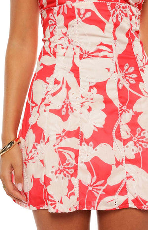 Model wears the Bellie Red Floral Mini Dress a cute summer outfit perfect for daytime events or a casual party. The dress features a sweetheart neckline and an A-line skirt for a flattering fit.