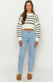 White chunky knit cropped sweater with black horizontal stripes and a crew neck