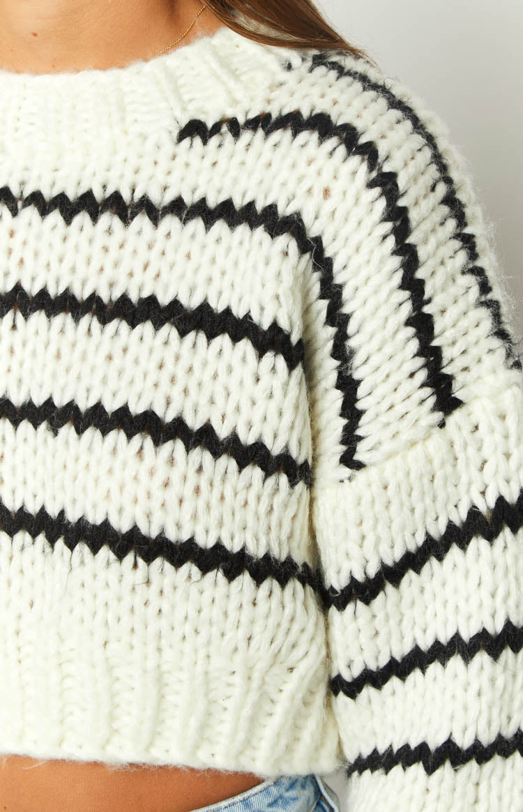 Relaxed fit white chunky knit sweater with black horizontal stripes and wide sleeves