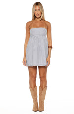 Front view of the blue and white stripe strapless mini dress, showing the straight neckline and gathered skirt