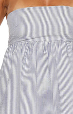 Close-up of the blue and white seersucker stripe mini dress, showing the strapless bodice and gathered waistline