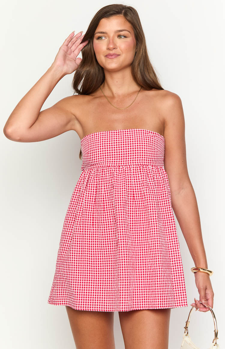 Close-up of the red gingham strapless mini dress with a gathered waist
