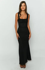 Black mesh maxi dress with a subtle textured pattern, square neckline, wide straps, and ruched bodice