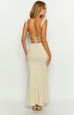 Rear view of a cream ribbed knit maxi dress with a backless design and criss-cross tie straps