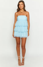 Front view of a light blue strapless mini dress with a ruched bodice and four tiered tulle ruffles
