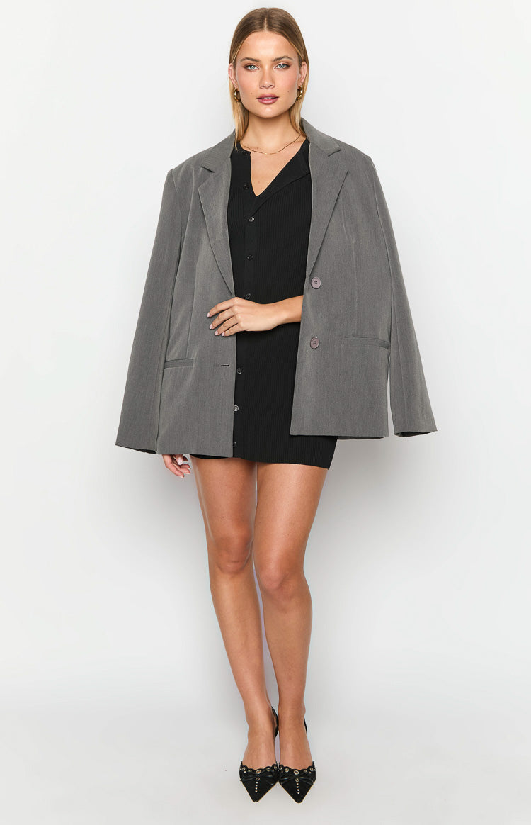 Black ribbed knit mini dress with a V-neck and full button-up front