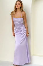 Lilac satin maxi dress with thin spaghetti straps, straight neckline, and ruched sides on the bodice