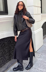 Brown PU jacket with a buttoned funnel neck, button-front closure, and flap chest pockets