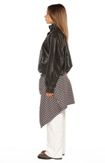 Side view of a brown PU funnel neck jacket with a relaxed fit, long sleeves, and chest pocket