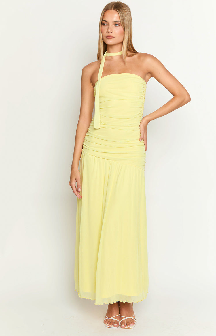 Yellow strapless maxi dress with a ruched bodice, neck tie detail, and flowy skirt with lettuce hem