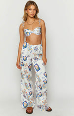 White satin wide-leg pants with a colourful all-over Italia print and comfortable elasticated waist
