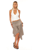 Girl wearing the brown and cream striped Brighton Midi Skirt with an asymmetrical hem a great addition to a vacation wardrobe or for creating an effortless street style look.