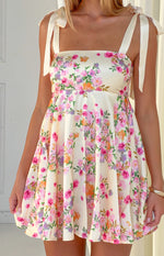 Cream floral mini dress with a square neckline and delicate tie-shoulder straps