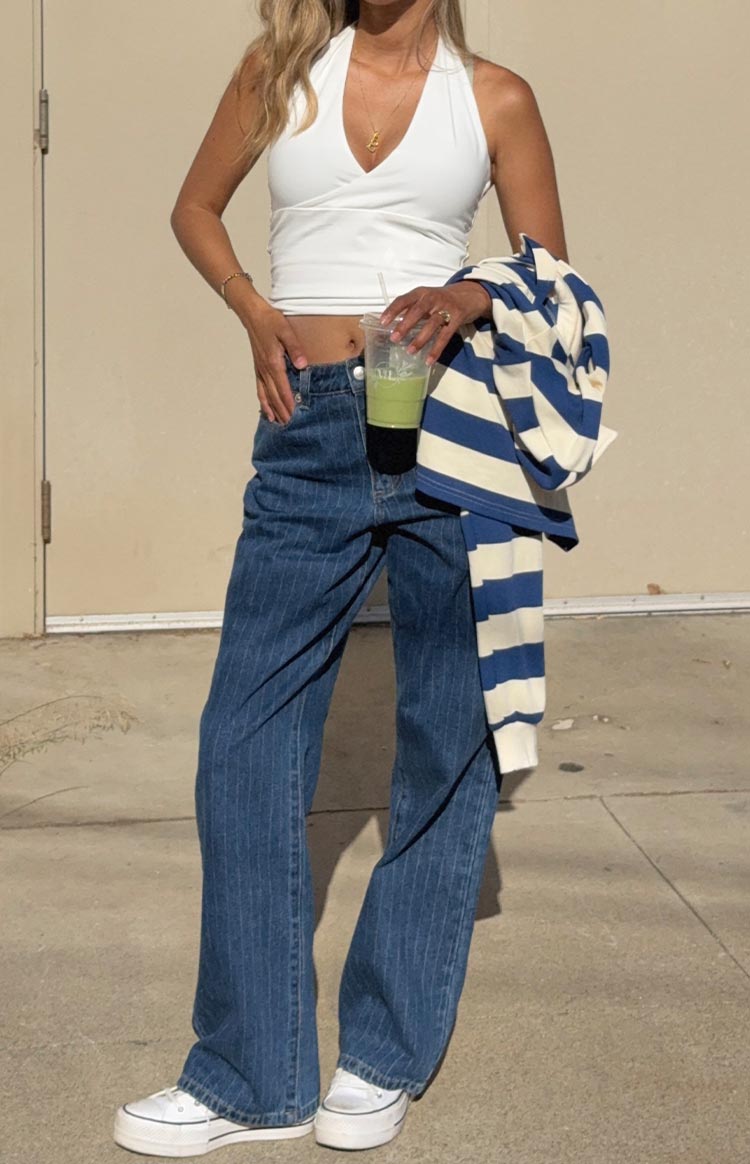 Mid wash pinstripe slouchy jeans with a wide leg and full length pooling at the ankles