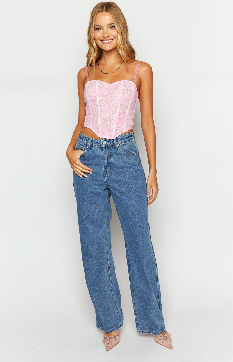 Front view of mid-wash blue mid-rise slouchy jeans with a relaxed wide-leg fit