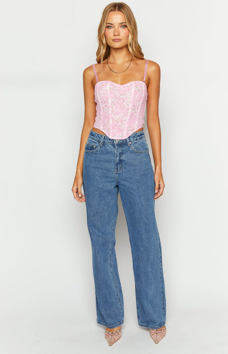 Front view of mid wash blue mid-rise slouchy straight-leg jeans with classic five-pocket styling