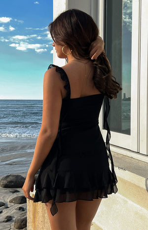 Black chiffon top with twisted bust, open front, ruffled straps, and long sheer flowing panels