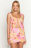 Close-up of the pink and yellow floral print chiffon mini skirt with a tiered ruffled hem