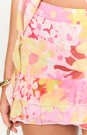 Close-up of the pink and yellow floral print chiffon mini skirt with layered ruffles and ruched detail