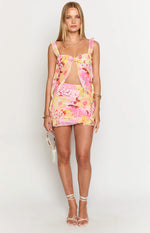 Pink and yellow floral print top with a knot-front sweetheart neckline, underbust cutout, and ruffled shoulder straps
