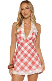 Front view of a red and white plaid mini dress with a deep V-neckline, white lace trim, and halter neck