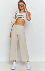 Beige linen blend wide leg pants with a high waist and cropped length