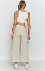 Beige linen blend wide-leg pants with a smooth back waistband and cropped length
