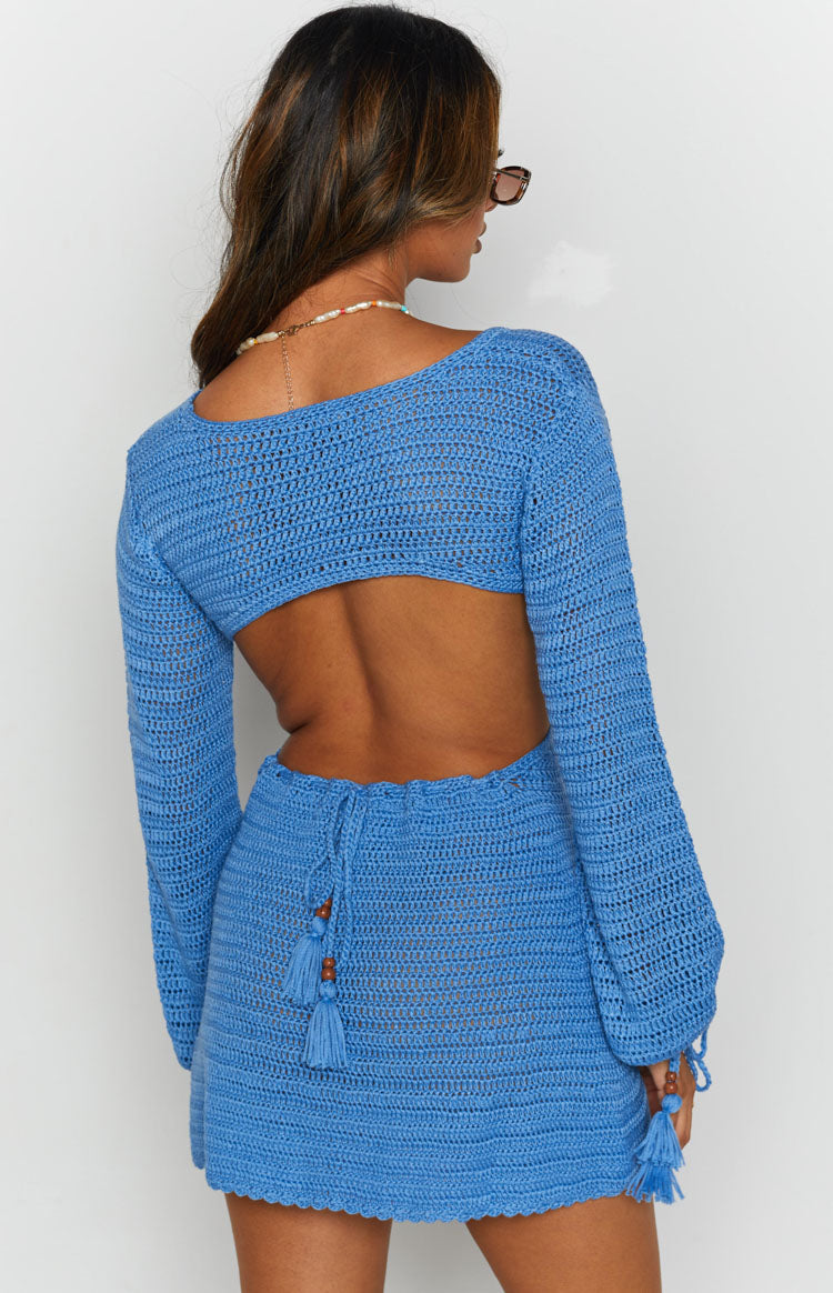 Blue crochet dress with a V-neckline, side waist cutout, and a matching blue ring detail